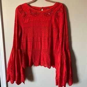 Free People. Bell sleeves. Tomato red color. Size S. Gently worn. Statement pc